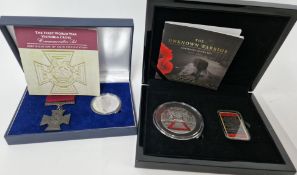 Two First World War commemorative silver proof sets, to include a Victoria Cross replica and 2018