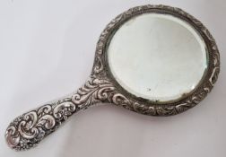 A white metal mirror, of intricate embossed foliate design, total weight approx 14.98oz.