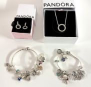 A mixed collection of Pandora jewellery including two bracelets with charms, earrings etc.
