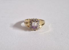 A diamond and light purple stone dress ring, set in 9ct gold, size N, approx 2.9g.