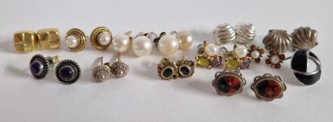 A mixed collection of stud earrings.