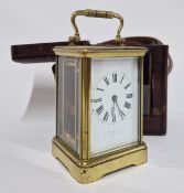 A French carriage clock in leather case with glass front, Roman enamel dial marked Fuselle Ltd,