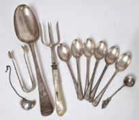 A Georgian silver serving spoon, hallmark rubbed, maker TW Thomas Wallis I, together with a set of