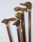 A collection of novelty walking sticks, to include handles in the form of duck, fish, parrot, fox,