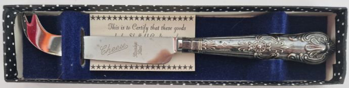 A silver handled stainless steel cheese knife, hallmarked Sheffield 1975.