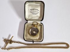 A gold plated albert watch chain together with a gold plated pendant with locket of hair to