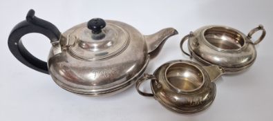 A George V silver tea service, to include teapot with ebonised handle, milk jug, and sugar bowl