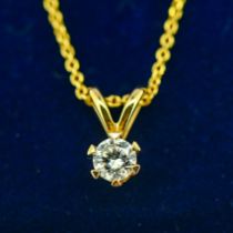 A 14ct yellow gold round brilliant cut diamond solitaire pendant on a gold plated silver chain,