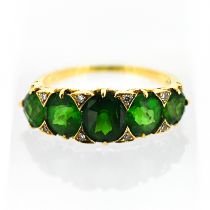 A green five stone and diamond ring, possibly Tsavorite/garnet, circa 1900, size L.