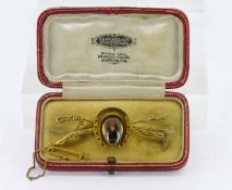 A good rare Essex crystal equestrian brooch with riding crops and a miniature painting in the centre
