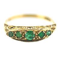 A five stone emerald set ring, set in 9ct yellow gold, size L/M, approx 2.1g.