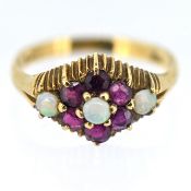 A ruby and opal set ring, set in 9ct yellow gold, size M, approx 2.4g.