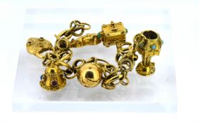 An 18ct yellow gold charm bracelet, set with six charms, total weight approx 43.4g.