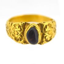 An antique gents signet ring, set in high carat gold, set with an amber stone, size I, approx 5.6g.