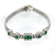 A 14ct diamond and emerald bracelet, set white gold, rectangular cut emerald, length approx 19cm,