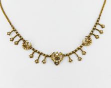 An Edwardian gold and seed pearl 'crescent and star' necklace.