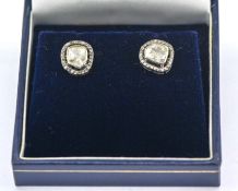 A pair of silver stud earrings set with Polki diamonds and rose-cut diamonds, Polki diamonds 0.65ct,