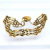A 9ct gold gate bracelet with heart padlock, total weight approx 6.3g.