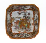 A Japanese square form bowl, of gilt and orange decoration of figures, blossom and birds.