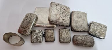 A collection of silver cigarette and vesta cases, together with a napkin ring, total weight approx