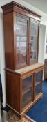A 19th century glass front bookcase, approx 203cm x 90cm x 45cm.