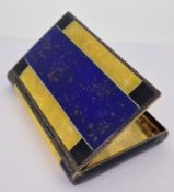 A decorative silver and enamel cigarette case, unmarked, of silver form with deep blue, yellow,