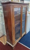 A 19th century mahogany bookcase with glass doors, on bracket feet, approx 150cm x 109cm x 35cm.
