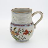 A small ‘famille-verte’ porcelain tankard, Kangxi (1662-1722), The globular body decorated floral