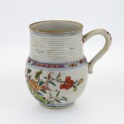 A small ‘famille-verte’ porcelain tankard, Kangxi (1662-1722), The globular body decorated floral
