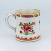 An 18th / early 19th century Chinese export ware mug, decorated in pink floral motif.