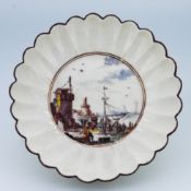 A Chelsea fluted dish or saucer, with painted dockyard scene, diameter 11.5cm.
