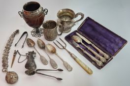 A collection of silver items, to include a tropical nut silver mounted goblet, two mugs, spoons,