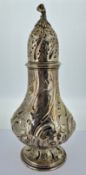 A Victorian foliate embossed sugar caster, elaborate finial, hallmarked London 1854, height approx