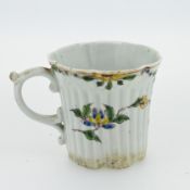An early Worcester fluted tea cup, with floral decoration.