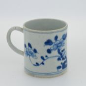 A Bow can mug in blue floral decoration.