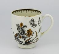 A Worcester tea cup, of monochrome floral decorated with gilt details.
