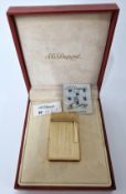 S.T.Dupont, a gold plated lighter, marked 15LKY88, with booklet, boxed.
