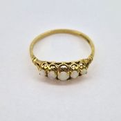 A 9ct gold and five stone opal ring, size O, approx 1.4g.