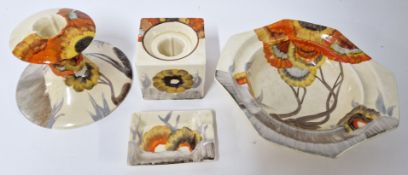 A collection of Clarice Cliff 'Rhodanthe' pattern pieces, to include an ashtray, bowl, cube