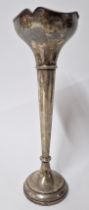 A silver spill vase, of trumpet form and filled base, hallmarked Birmingham 1924, height approx