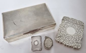 A collection of silver items, to include a Victorian vinaigrette, a foliate engraved card case,