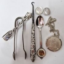 A pair of continental silver sugar tongs in the form of leaves, marked 800, together with a silver