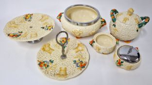 A quantity of Clarice Cliff 'Celtic Harvest' pattern tableware, to include fruit stand and