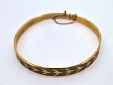 A 9ct gold bangle, approx 11.6g.