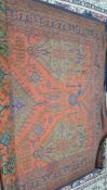 A patterned rug, approx 280cm x 350cm