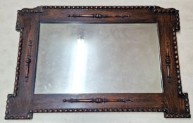 An oak framed mirror, approx 60cm x 89cm.