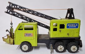 PowerHouse Earthmovers, a tin mobile crane, together with various toys, model vehicles, to include