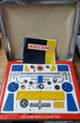 Meccano, a fitted boxed set, to make combine harvester, rocket launching vehicle, etc, with book