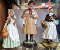 Three Royal Doulton figurines, to include ‘The Milkmaid’ HN2057, ‘Lambing Time’ HN1890, and ‘Country