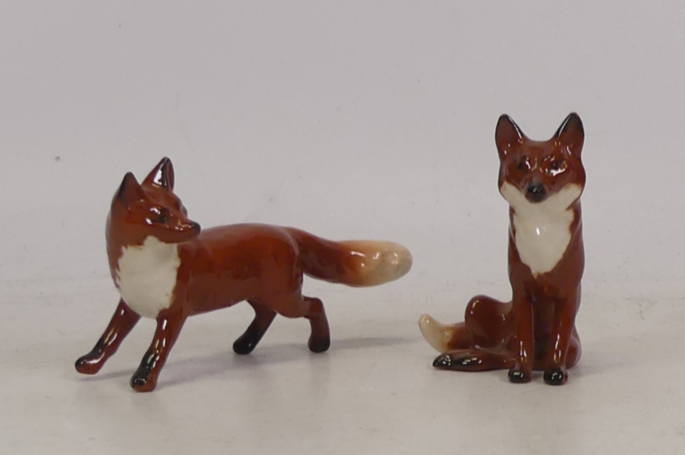 Beswick, Two Models of a seated and alert Fox. (2)